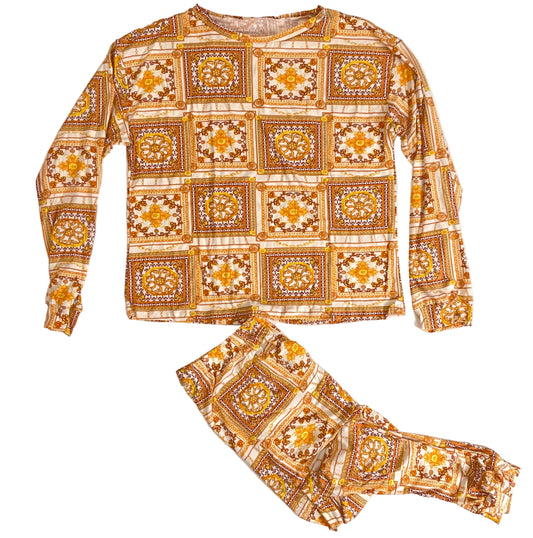 Patterned long-sleeve shirt and pants set on a light background