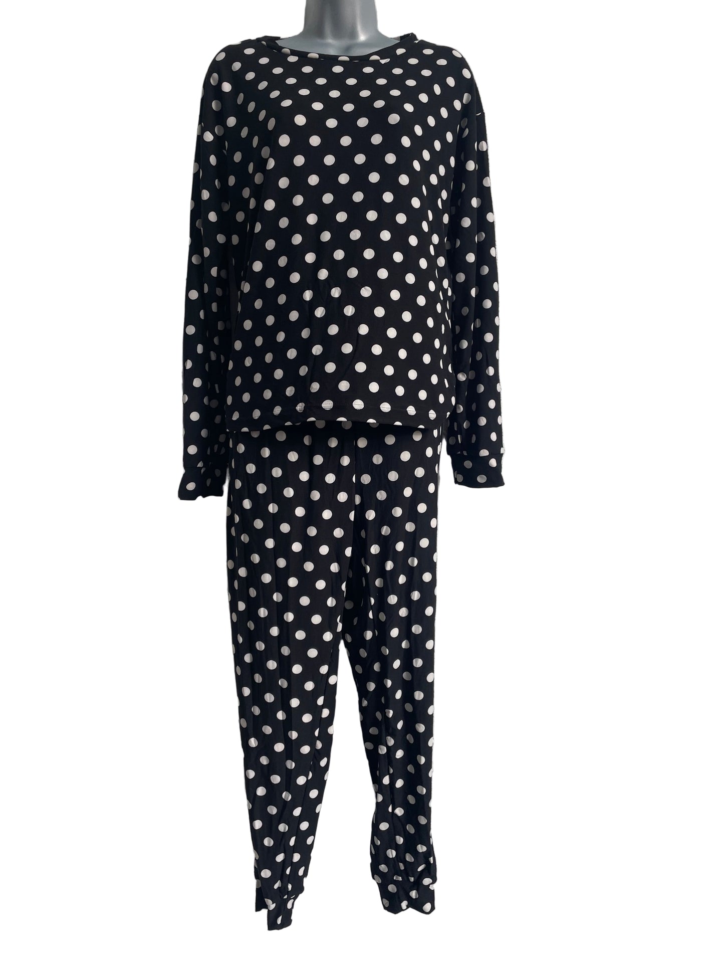 Black fabric with white polka dots.