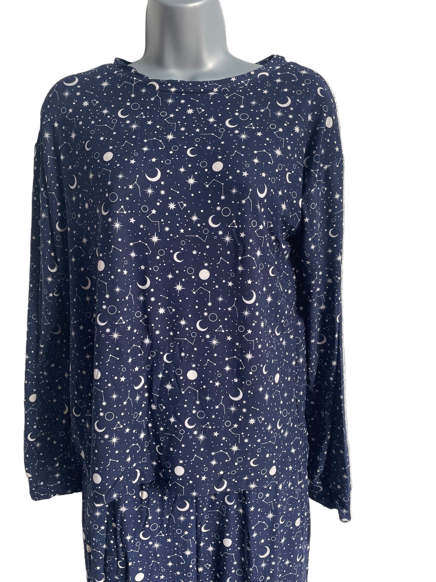 Folded navy blue fabric with celestial pattern on a white  background