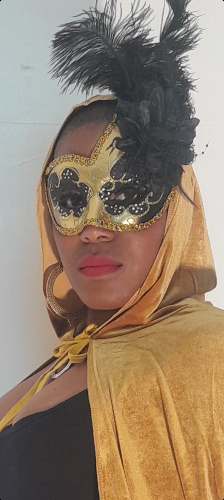 gold and black  mask with feathers